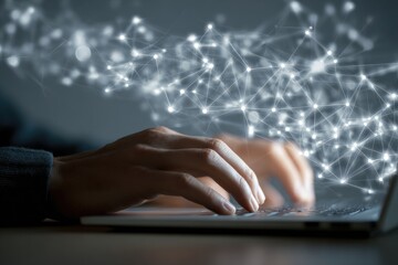 Close-up of hands typing on a laptop, overlaid with a network of light