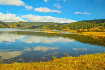 Colorful hills and blue lakes create a serene panorama
Pudacuo National Park, Yunnan, China,...