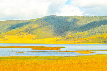 Colorful hills and blue lakes create a serene panorama
Pudacuo National Park, Yunnan, China,...