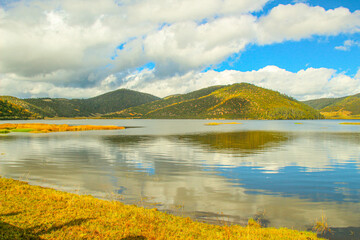 Colorful hills and blue lakes create a serene panorama
Pudacuo National Park, Yunnan, China,...