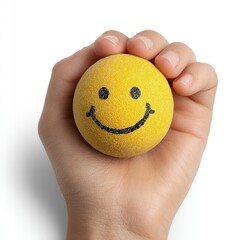 Child's Hand Holding Glittery Smiley Face Ball