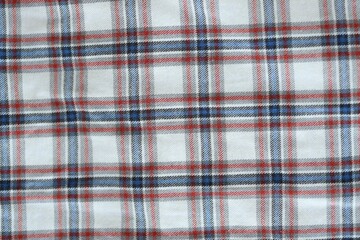 Red and Grey Checkered Fabric Background Texture. Cloth, tapestry or plaid with lot of folds