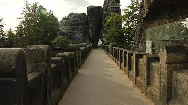  Famous Bastei Bridge in morning without tourists in Saxon Switzerland National Park, Germany. Popular tourist destination surrounded by sandstone cliffs.