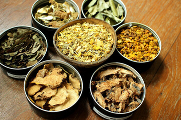 Assorted Thai Dried Herbs in Small Bowls for Spa, Herbal Medicine, and Natural Organic Wellness