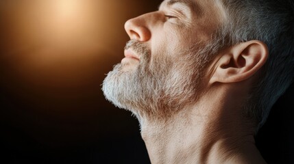 Obraz premium Illuminated side view of neck and collarbone in warm light.