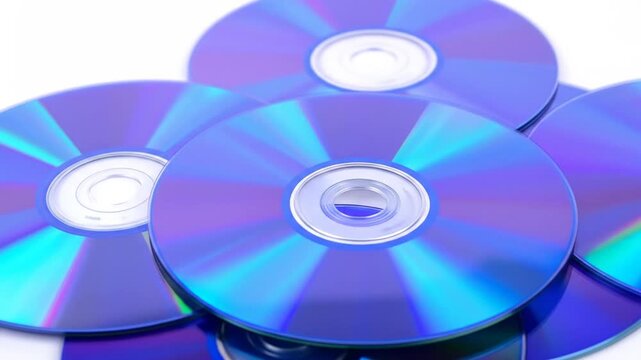 Pile of Purple Data Discs on a White Surface Data Storage Media Technology Digital Optical Round Background Pattern Light and Reflection