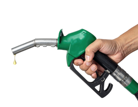 A green fuel pump nozzle held in a hand with a droplet of fuel forming at the spout. - Powered by Adobe