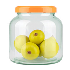 Yellowish green fruits preserved in glass jar