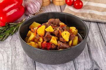 Rogiut with meat, potato and tomatoes