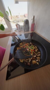 Stirfrying colorful vegetables in a modern kitchen is key to making delicious meals