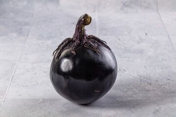 Raw round black big eggplant