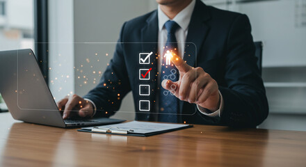 Professional businessman completing digital checklist on virtual interface with modern laptop in office setting for hiring needs