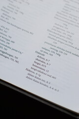 A close-up of an open medical textbook, showing detailed text and diagrams about human physiology and biology. This image represents study, education, research, and the journey of a medical student.