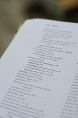 Obraz premium A close-up of an open medical textbook, showing detailed text and diagrams about human physiology and biology. This image represents study, education, research, and the journey of a medical student.