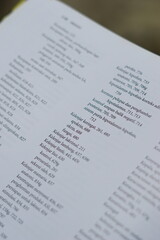 Fototapeta premium A close-up of an open medical textbook, showing detailed text and diagrams about human physiology and biology. This image represents study, education, research, and the journey of a medical student.