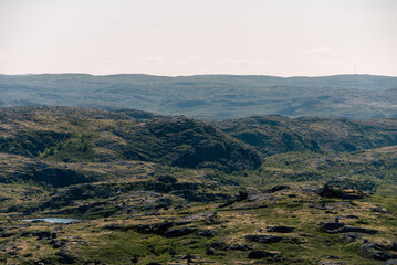 Naklejka premium landscape Russian North view in the tundra with a mountain river and a lake in the mountains