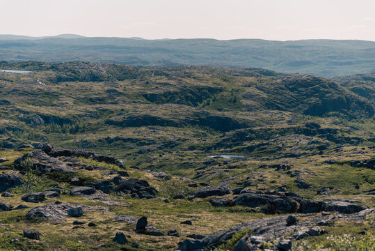 landscape Russian North view in the tundra with a mountain river and a lake in the mountains