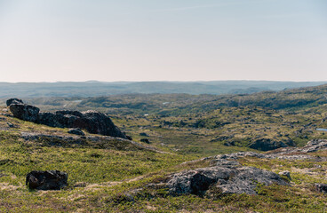 Naklejka premium landscape Russian North view in the tundra with a mountain river and a lake in the mountains