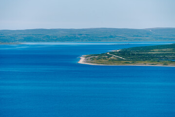 Naklejka premium landscape Russian North view in the tundra with a mountain river and a lake in the mountains