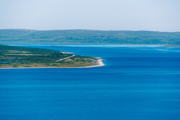 Naklejka premium landscape Russian North view in the tundra with a mountain river and a lake in the mountains