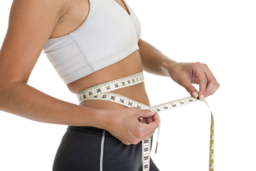 Woman is holding a tape measure around her waist