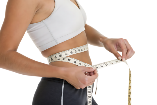 Woman is holding a tape measure around her waist