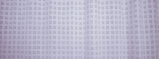 Textured Pattern: A close-up view of a delicate textile, where intricate squares create a rhythmic dance of shadows and light, this image of the fabric's beauty in a simple, elegant manner.