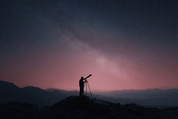 Fototapeta premium Silhouette gazing at the Milky Way with a telescope on a mountain. Inspiring image for science, exploration, discovery, dreams, and ambition concepts. Space background.