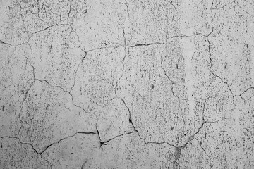 Textured Cracks on Gray Surface: Intricate network of cracks spread across a weathered gray surface, showcasing a texture of age and the subtle interplay of light and shadow.