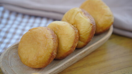 Homemade Fried Donuts on a Wooden Tray