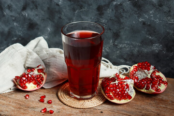 Pomegranate juice with fresh pomegranate fruit. Healthy drinking and antioxidant.