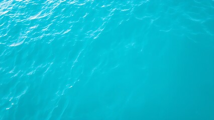 Abstract aerial view of turquoise water with soft wave patterns and gradient blue tones, evoking summer serenity.