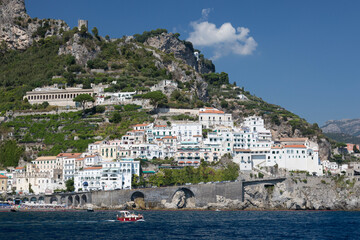 Amalfi, Italy - August 19, 2019: View from the sea to the town of Amalfi in Italy on the coast of the Tyrrhenian Sea