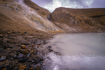 Steam rises from the rocky slopes of Iceland’s Víti crater where geothermal heat meets the milky blue waters of the volcanic lake