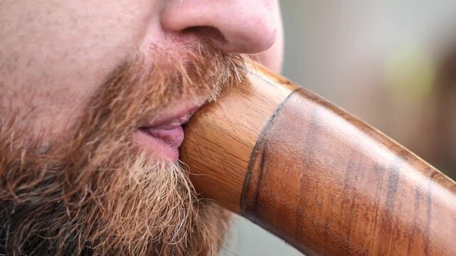 Musician playing didgeridoo in India