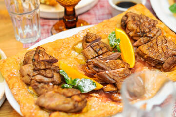 fried sliced ​​chicken on pita bread