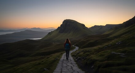 Obraz premium Lone Figure Ascending Highland Path Pre-Sunrise