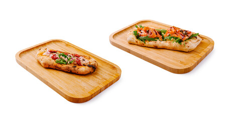Delicious flatbreads topped with fresh ingredients served on wooden trays