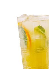 Refreshing summer drink with citrus and mint served in tall glass