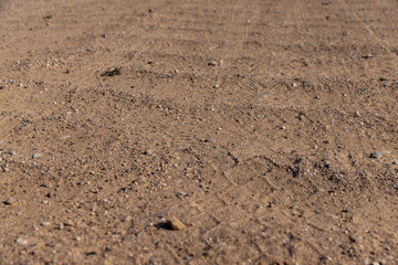 a bad road in rural areas with a lot of bumps, a very dangerous and uneven road for motor vehicles in the village
