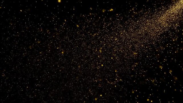 Golden glitter particles burst from a corner on a black background this abstract image represents a magical explosion festive celebration or luxury award