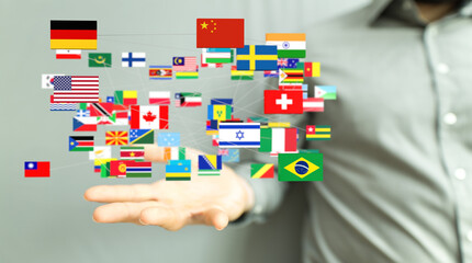Image of hands holding a network of interconnected flags representing global business and international connections.