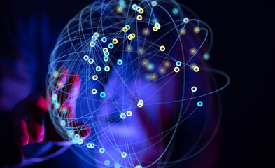 Hand interacting with a glowing sphere representing data connections and network technology.