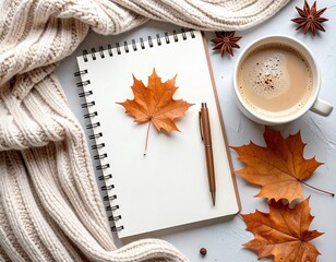 Autumn background with a cup of coffee, a notebook, a pen, autumn leaves, pine cones and a warm sweater