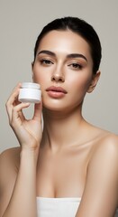 Woman holding cosmetic cream jar for skincare and beauty product advertising
