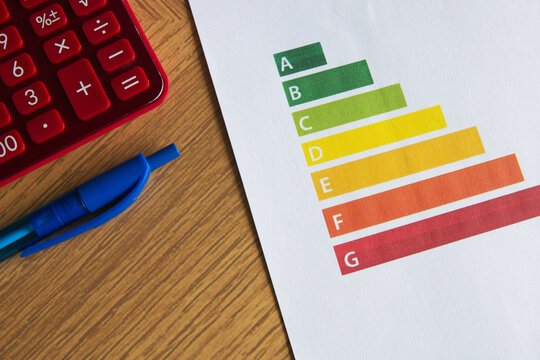 Sheet of paper with energy certification scale on the table