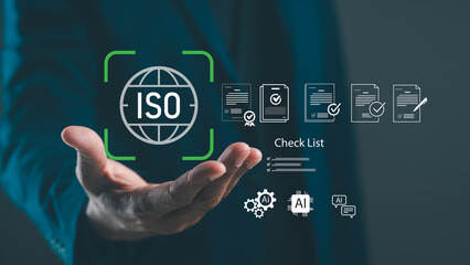 A professional hand extends towards ISO certification icons, symbolizing quality management and compliance in a digital environment.