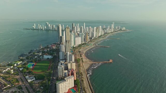 Slow motion overview of cartagena de indias coastline at sunset, bocagrande neighborhood, colombia