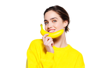 Happy woman holding banana, promoting healthy eating habits.