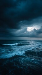 Obraz premium Dramatic seascape with dark storm clouds over the ocean at dusk or dawn
